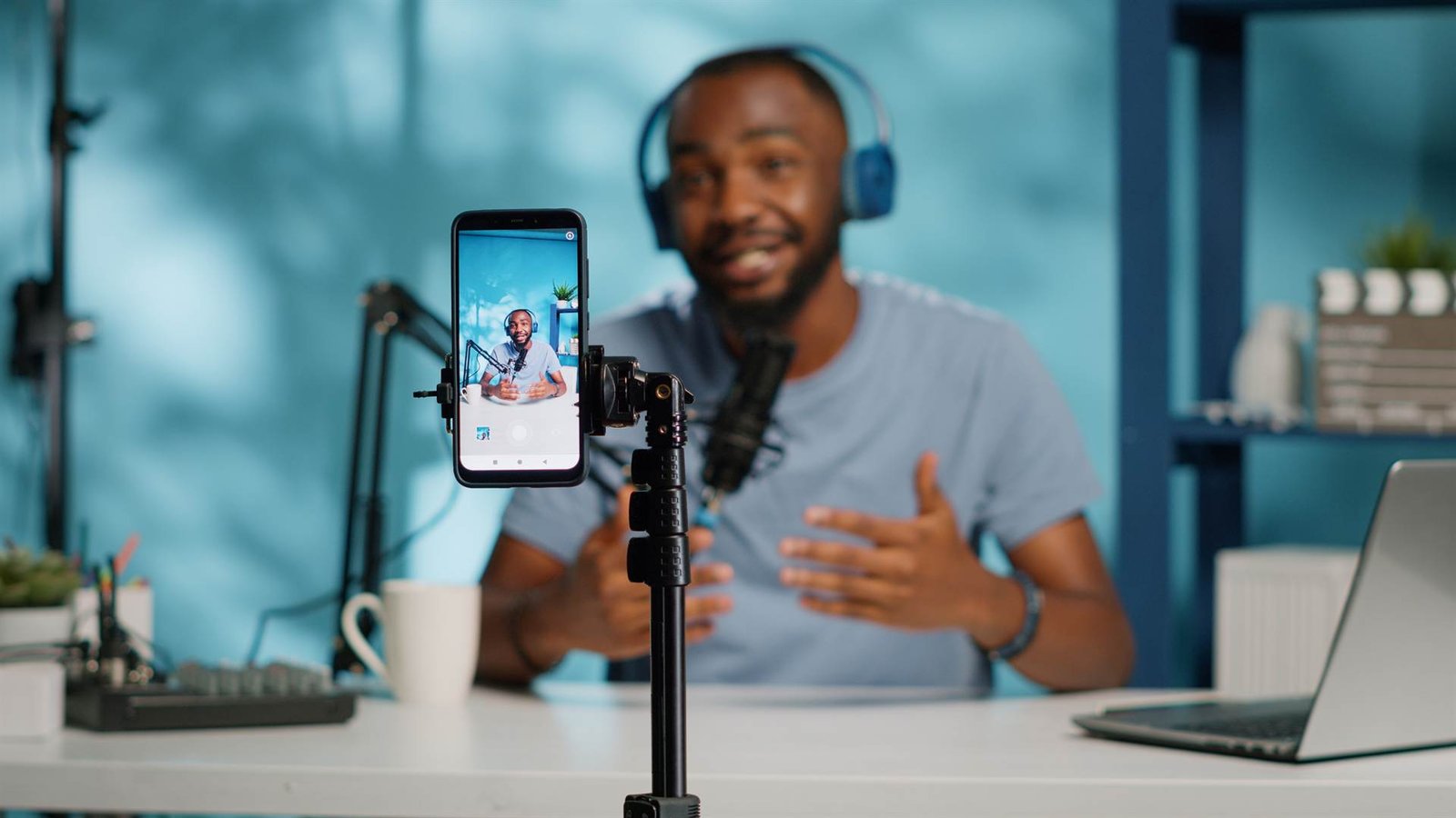 Content creator filming a video on a smartphone