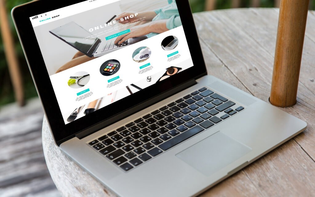 a metallic body laptop showing the web page of an online shop showing the necessaty of web development for every business in today's world